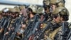 Бойцы "Талибана" занимают позиции в аэропорту Кабула после того, как оттуда улетел последний самолет США. Многие одеты в трофейную американскую форму. 31 августа 2021 года